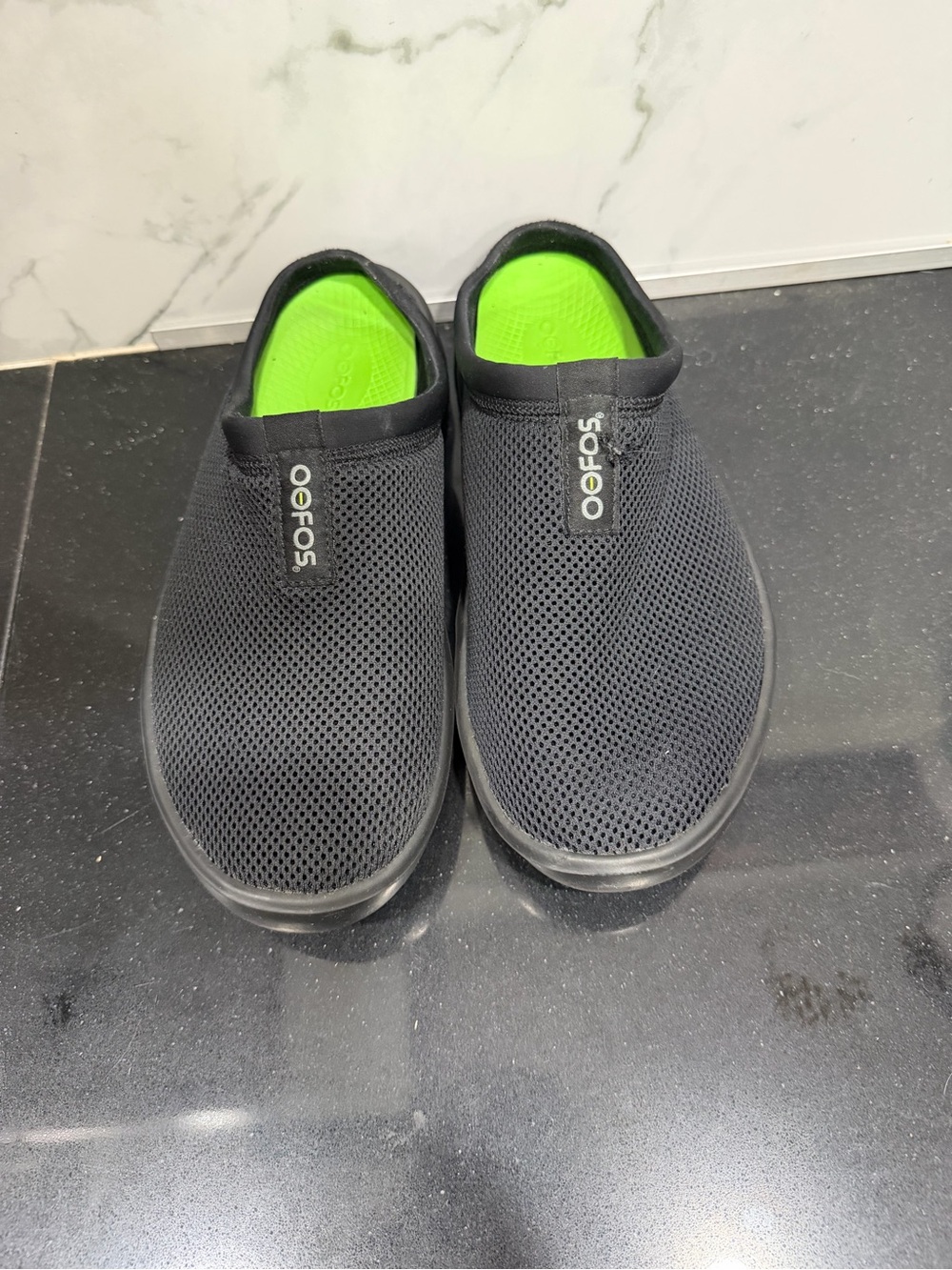 OOFOS Black Slip-On Recovery Clogs with Neon Green Insole
